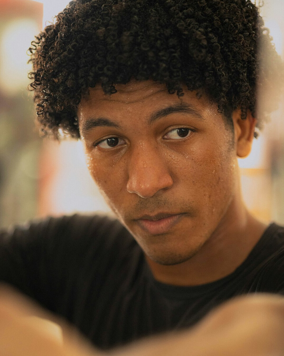 Portrait of a young man with curly hair