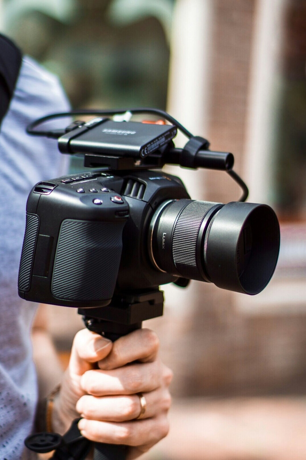 Videographer filming a live event with a professional camera