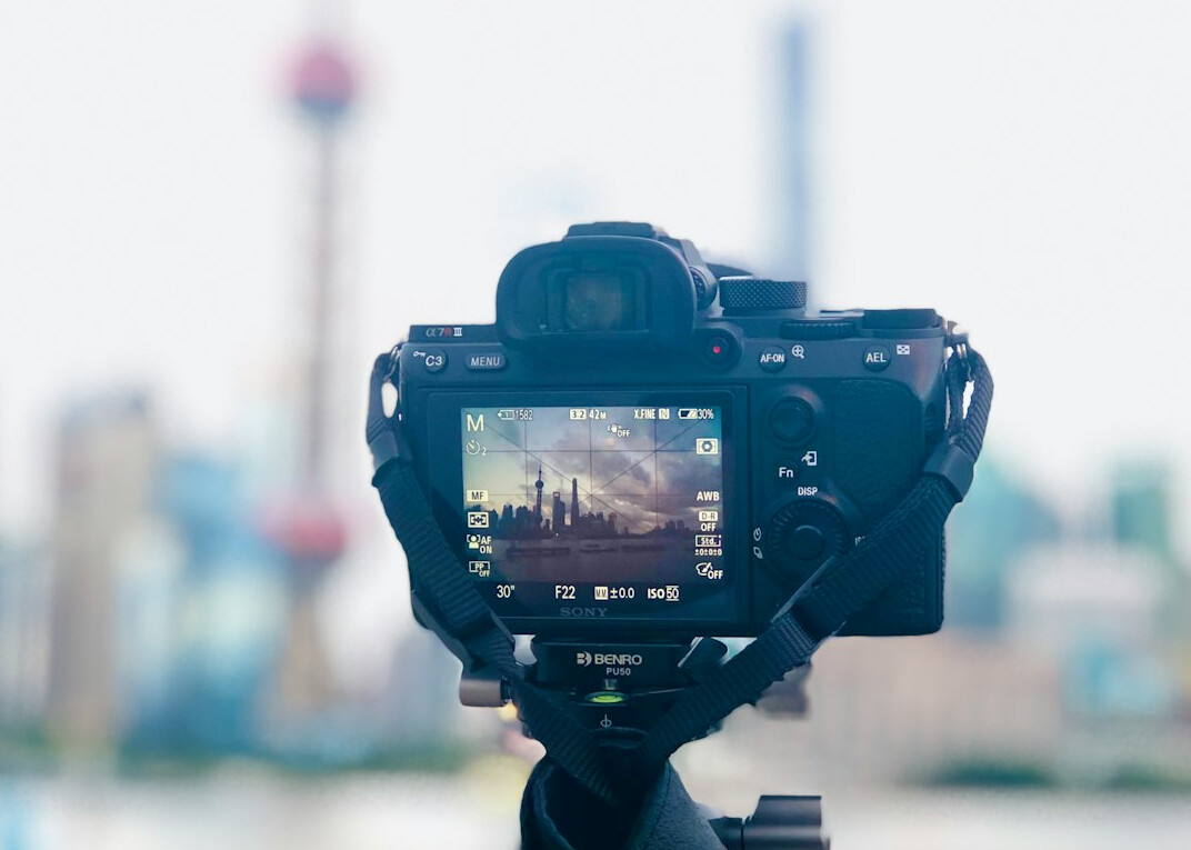 Camera crew filming a corporate promotional video in an office